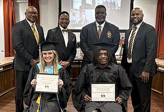 Kendrick Smith, back row from left, James Mills, Antonio Williams and Michael Rhodes stand behind the first recipients of the North East Texas Association of Alpha Men Inc. 2024 scholarship during an awards ceremony Monday, May 6, 2024, at Village of Communities of Texarkana, Texas. The recipients are, front left, Brianne Davis, a senior at Mount Pleasant High School, and Keidren “Winky” Williams, a senior at DeKalb High School. (Staff photo by Sharda James)